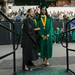 A graduate receives a few words of wisdom from Darlene Tankersley as she waits next in line to receive her diploma.
Courtney Sacco I AnnArbor.com 
 